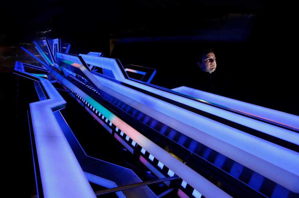 Sculptor Jason Paterson has a close look at his latest piece ' The Energy Sculpture' at his workshop in Rutherglen.