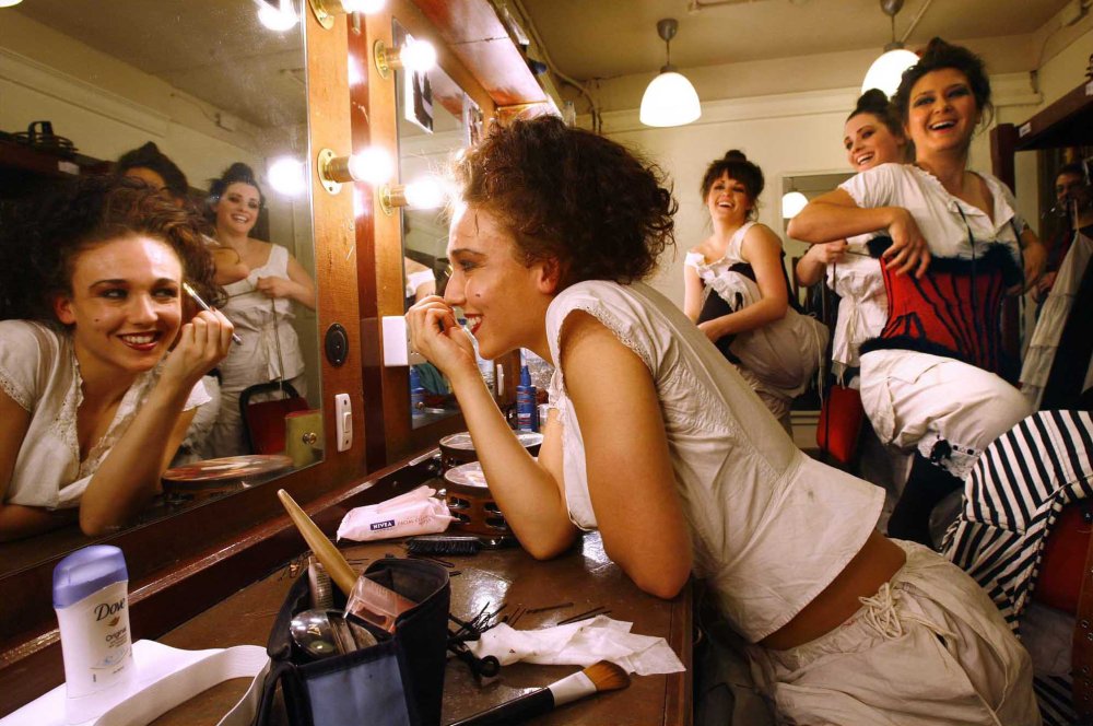 Dancers from Scottish Opera's new production of La Traviata get ready in the dressing room of the Theatre Royal in Glasgow for the dress rehearsal in advance of the opening night performance on 30th Oct Putting on make up is Sophia McGregor watched by l to r Nicki Munro , Jenna Sloan and Jo Jeffries and Jenna Sloan